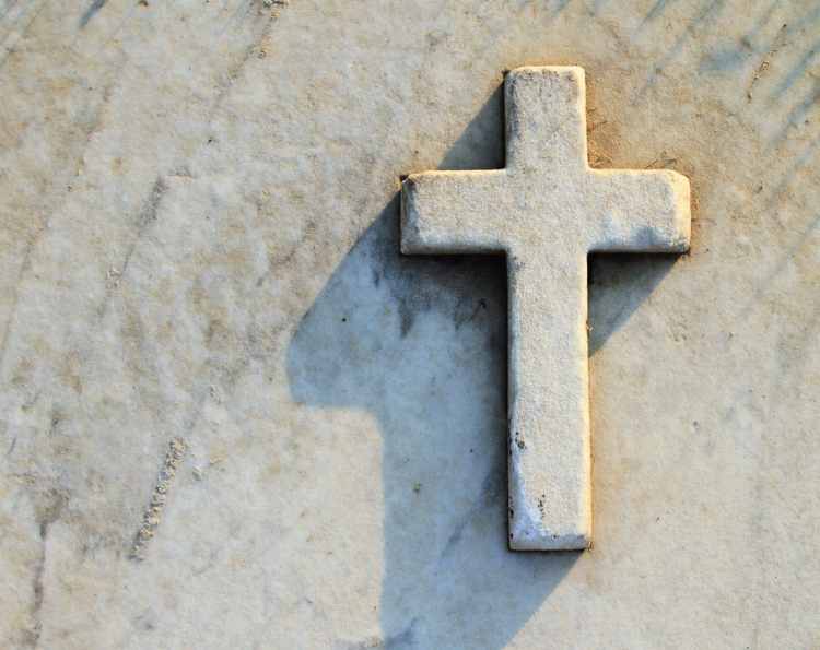 Cross on stone